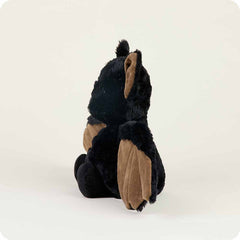 Plush toy bat with brown winhgs and ears on a white background