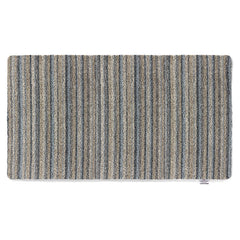 Ribbon Grey Striped Washable Runner- a 100% recycled material runner featuring a subtle striped pattern in shades of beige, light brown, and blue.