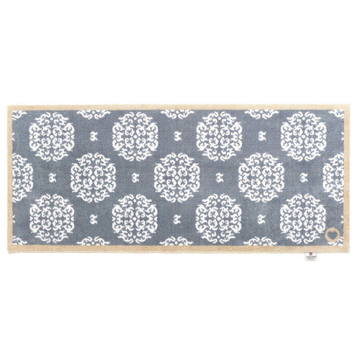 Home 44 Washable Runner in Grey- a 100% recycled cotton runner featuring a horizontal array of white floral patterns.